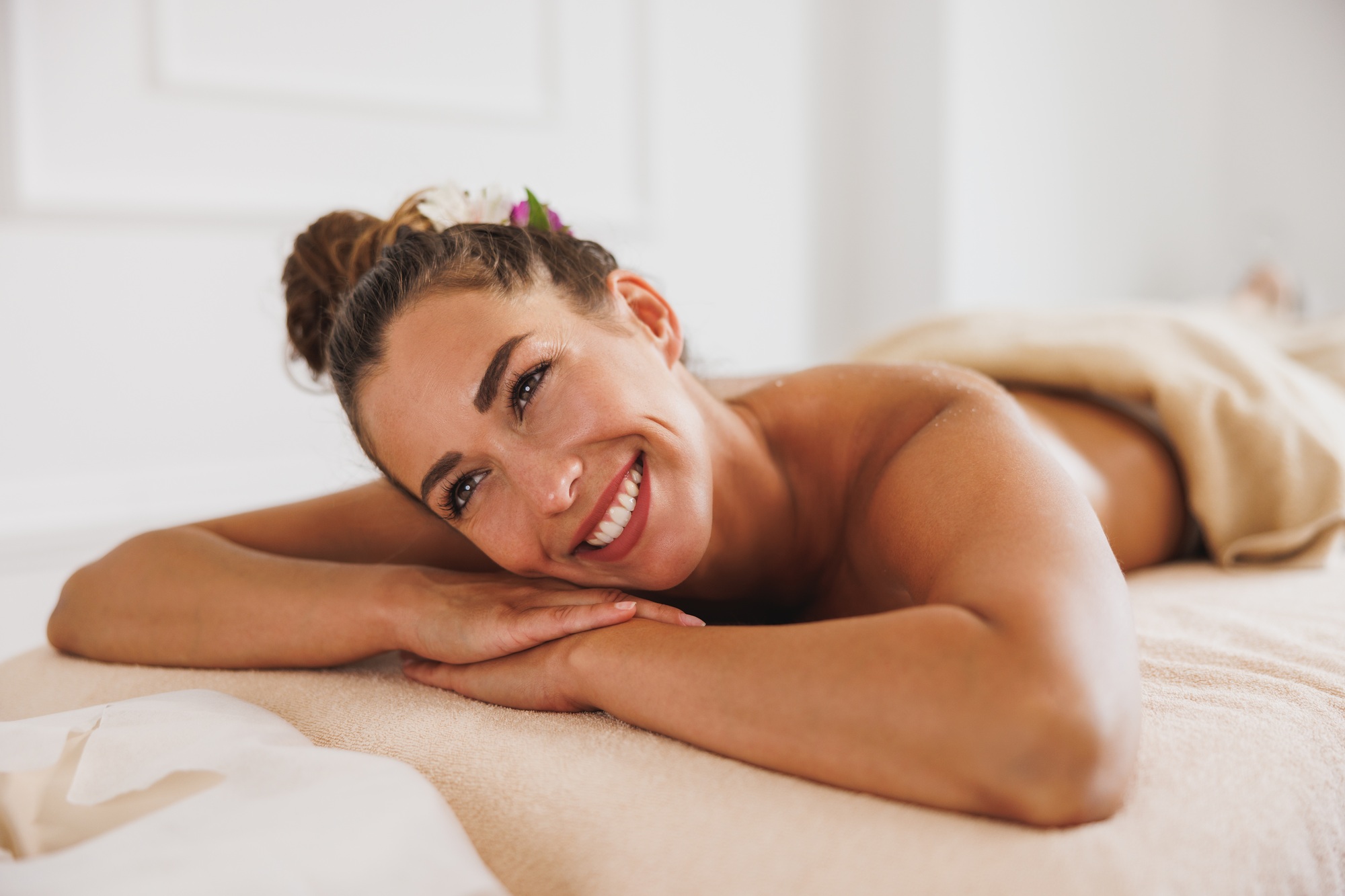 Woman Enjoying Massage In Spa Centre